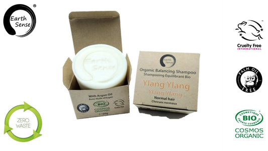 Organic shampoo bar in a cardboard box with Earth Sense branding and sustainability logos.