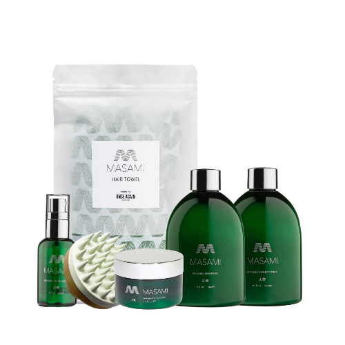 Set of Masami hair care products including shampoo, conditioner, towel, and other items on a white background