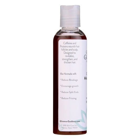 Bottle of Glimmer Goddess hair product on a white background